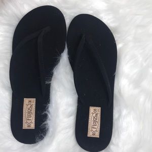 NWOT black flojos flip flops